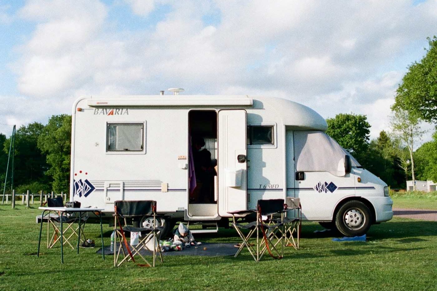 Motorhome parked on a grassy campsite