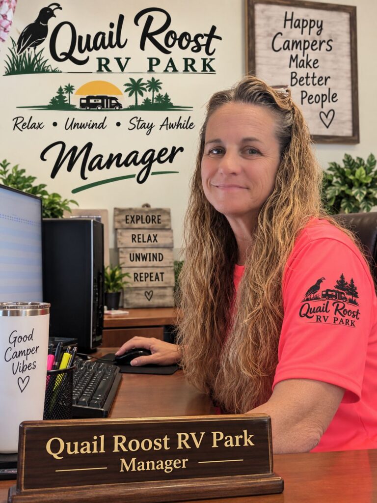 Jodi, manager of Quail Roost RV Park, at her office desk